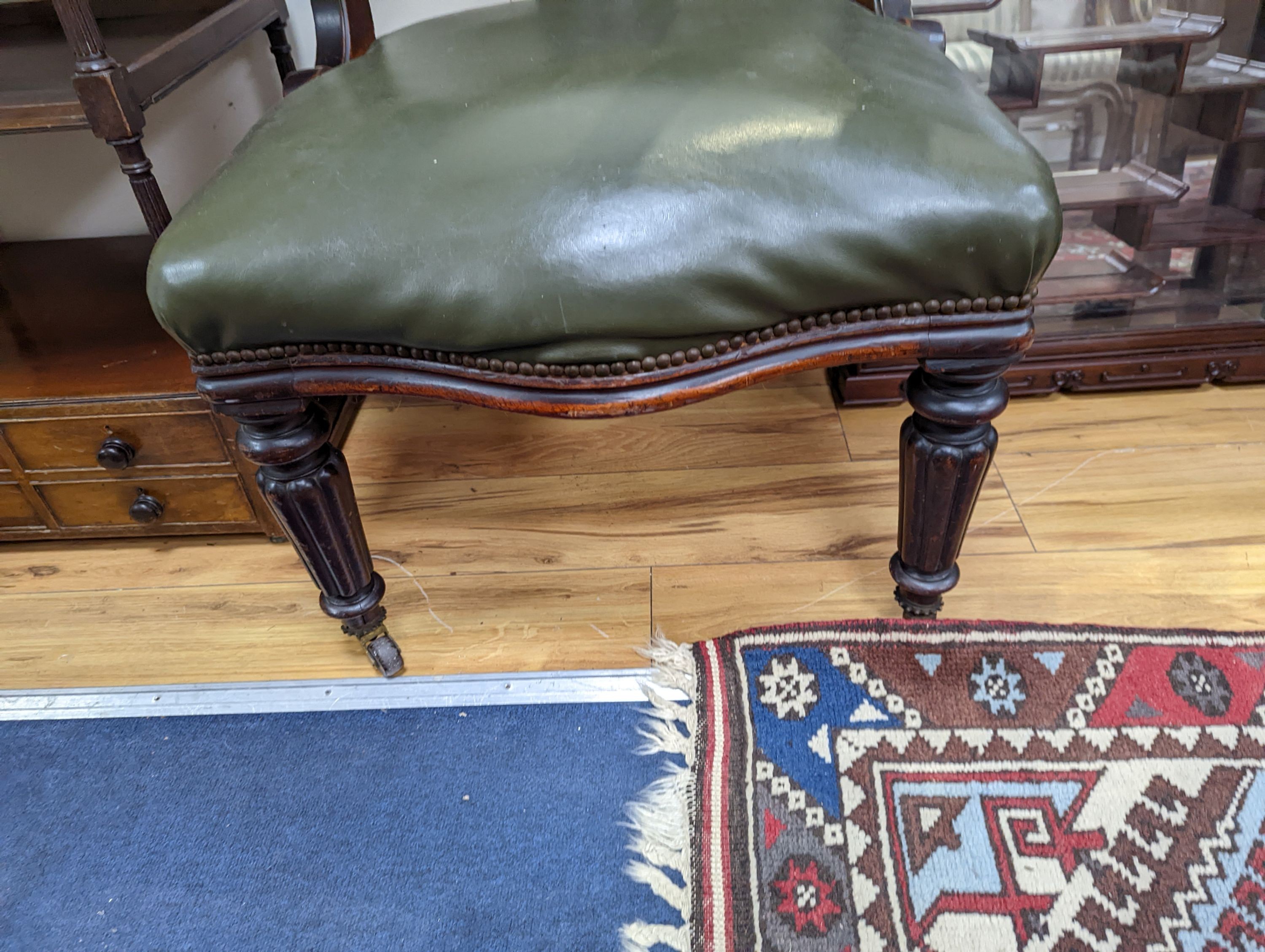 A Victorian mahogany tub framed chair upholstered in green leather, width 60cm, depth 58cm, height 66cm